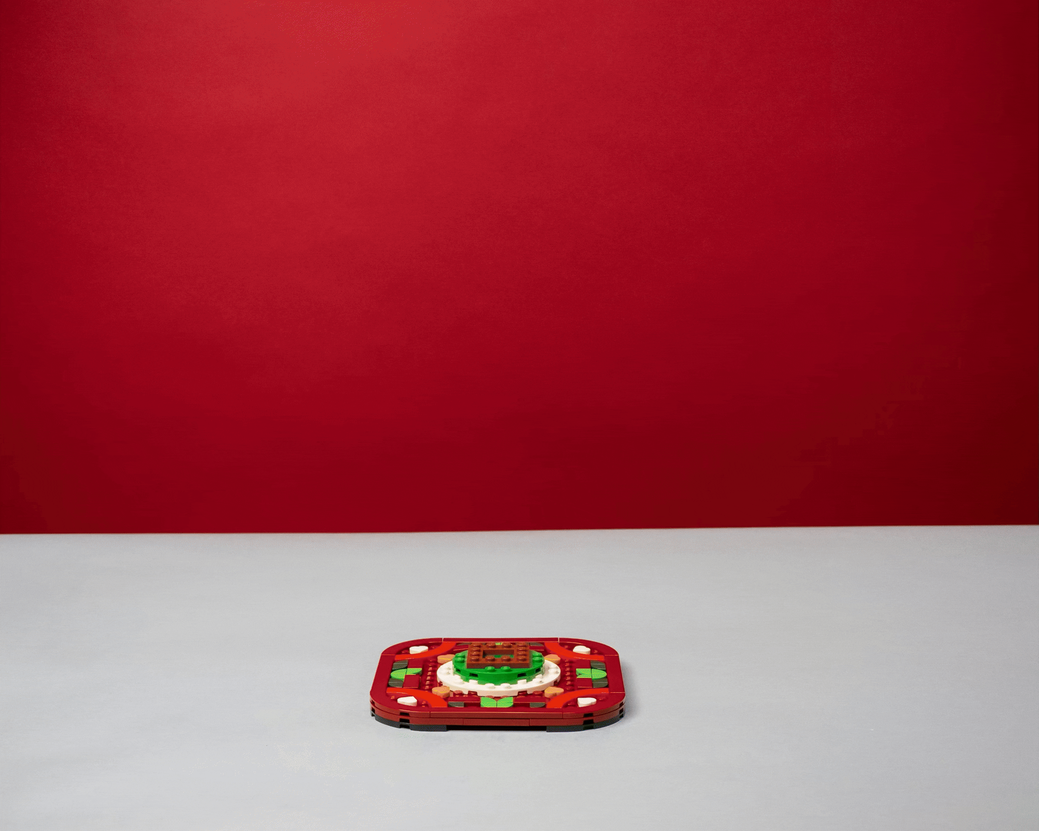 a stop motion video of a lego christmas tree kit being assembled