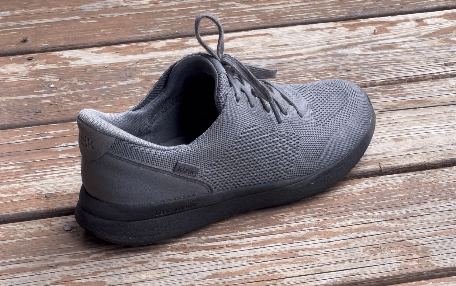 A person putting on a pair of Kizik Lima Shoes